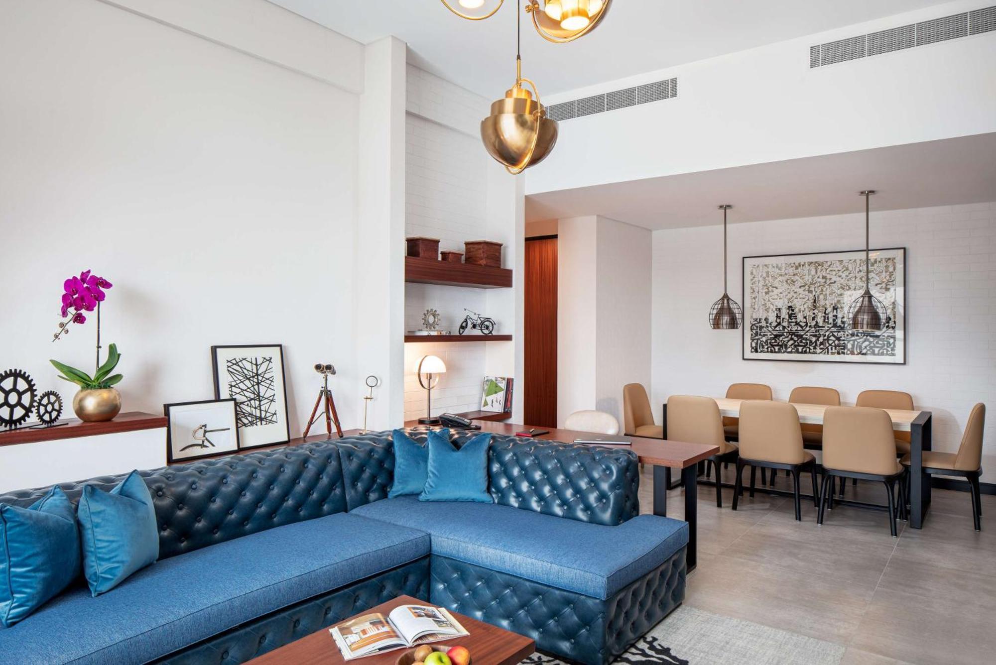 Doubletree By Hilton Dubai M Square Hotel & Residences Εξωτερικό φωτογραφία A living room in a suite at the hotel