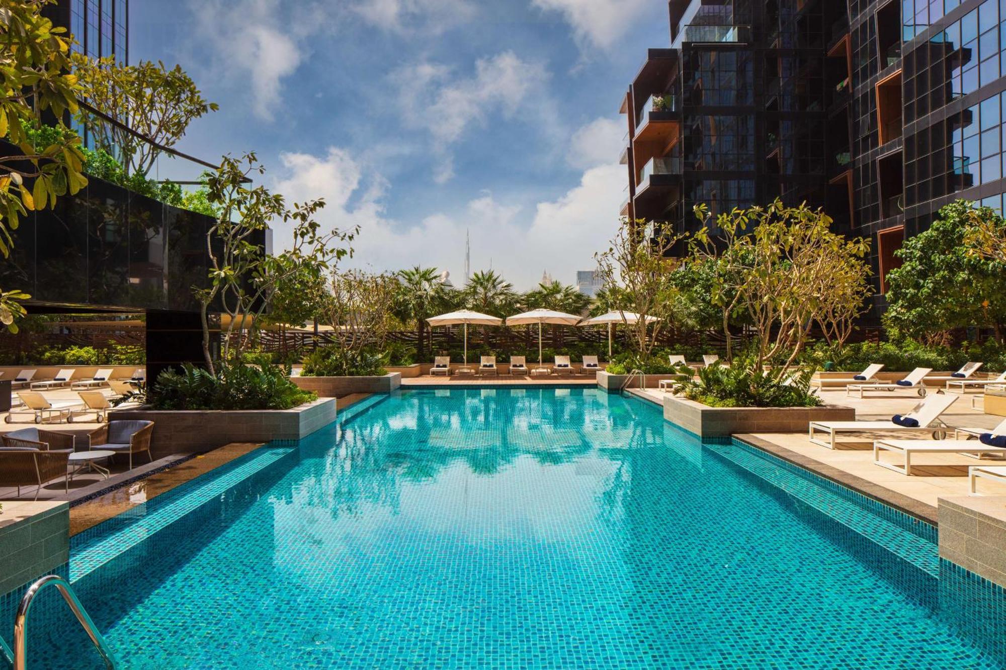 Doubletree By Hilton Dubai M Square Hotel & Residences Εξωτερικό φωτογραφία The swimming pool at The Hari